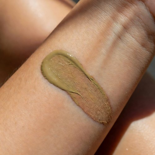 Foundation swatch on forearm, direct sunlight
